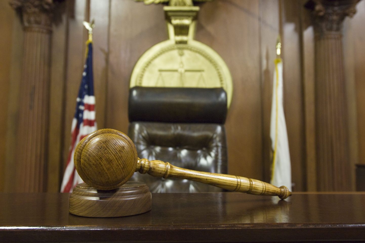 Hammer and gavel near judges chair in court Royalty free: For comercial usage price on demand