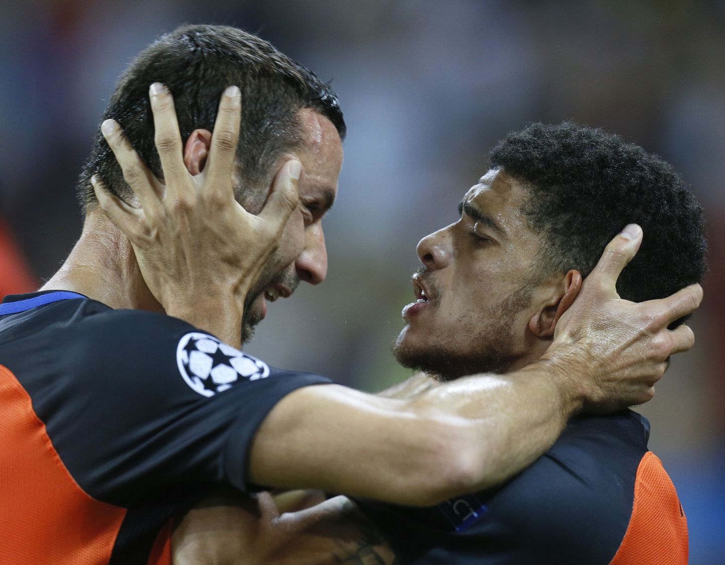 Shakhtar's Taison, right, celebrates with his teammate Dario Srna after scoring his side's first goal during the Group F Champions League soccer match between Shakhtar Donetsk and Napoli at the Metalist Stadium in Kharkiv, Ukraine, Wednesday, Sept. 13, 2017. (AP Photo/Efrem Lukatsky)