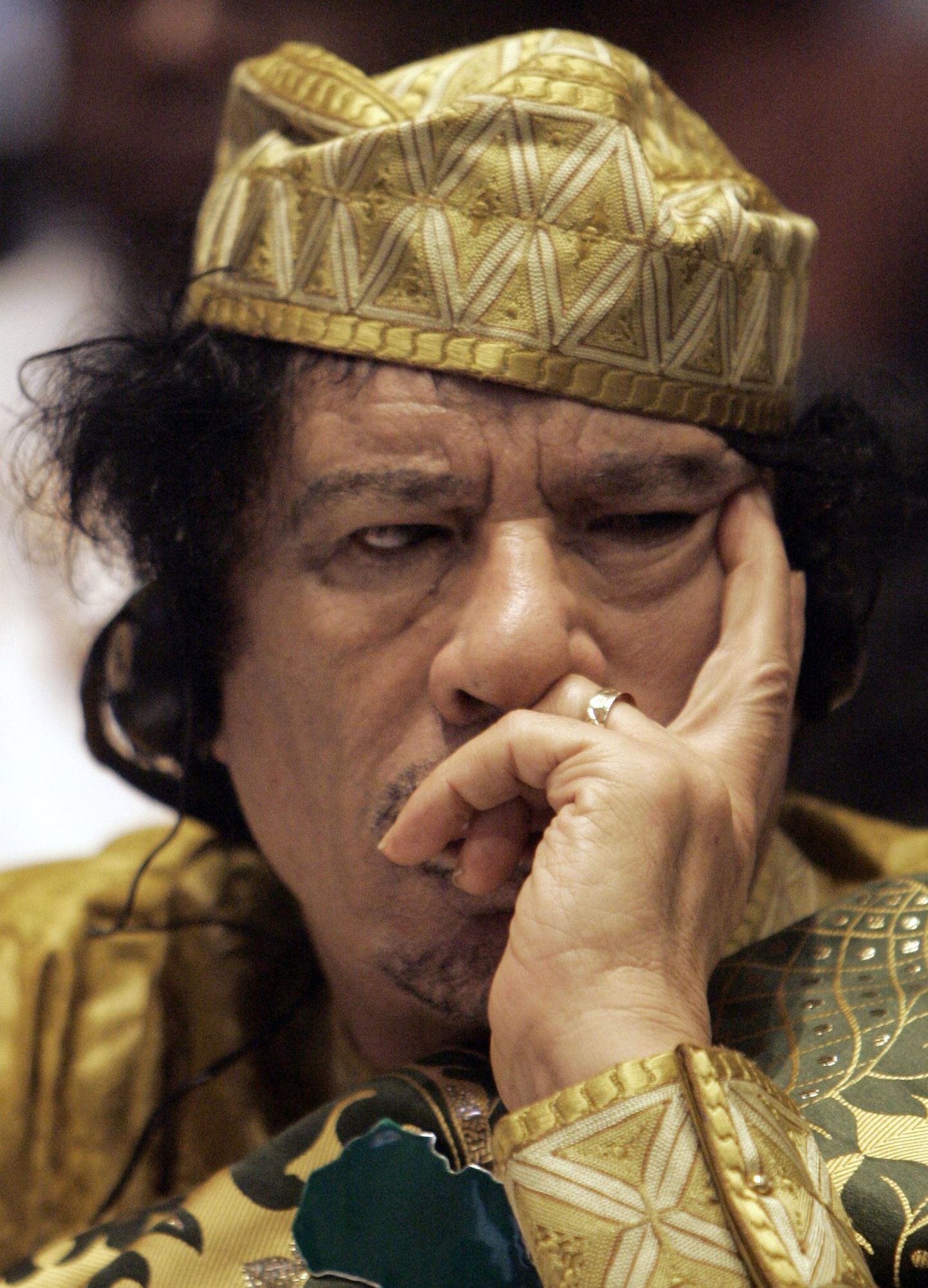 Муамар Каддафи.
