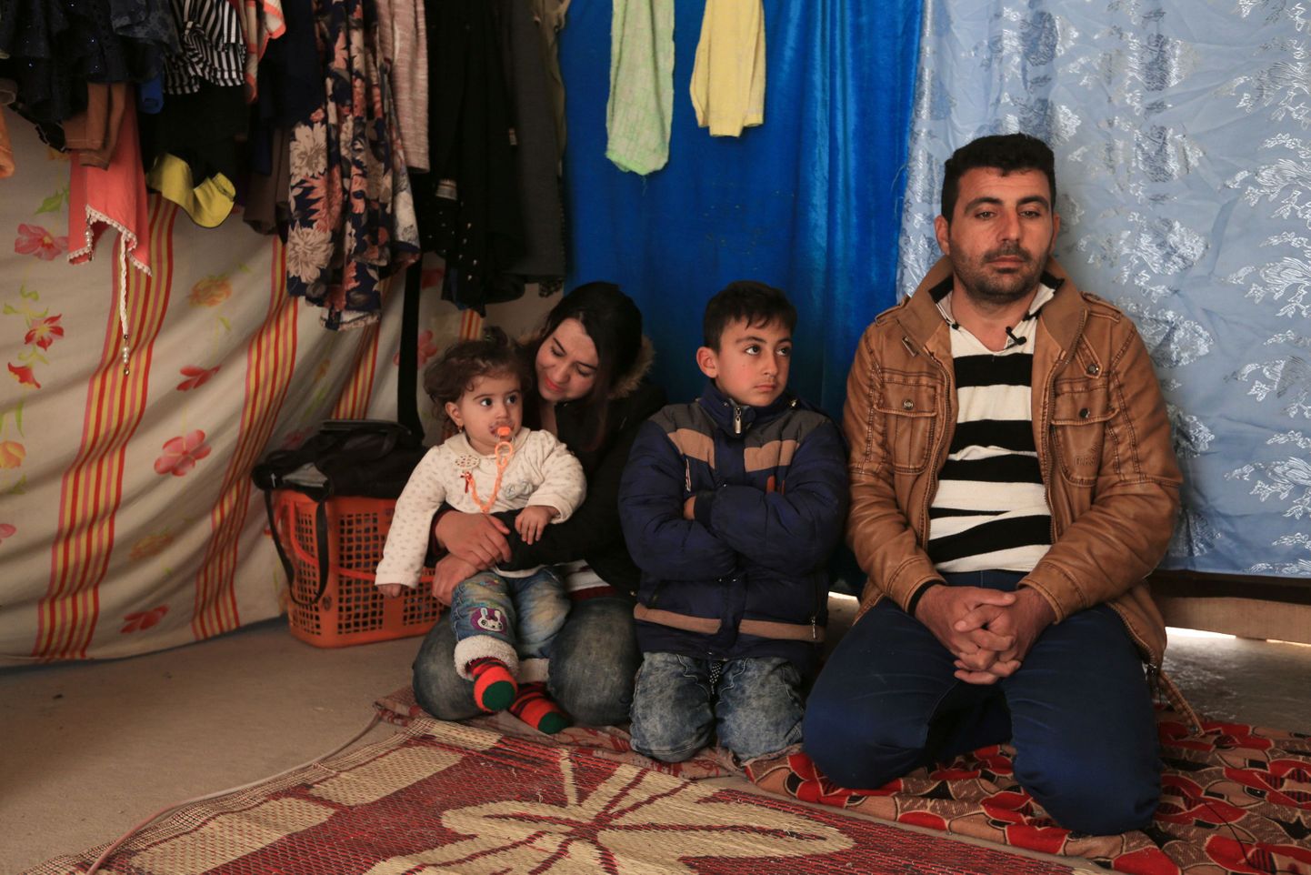 Tagasi saadetud Iraagi põgenike perekond.