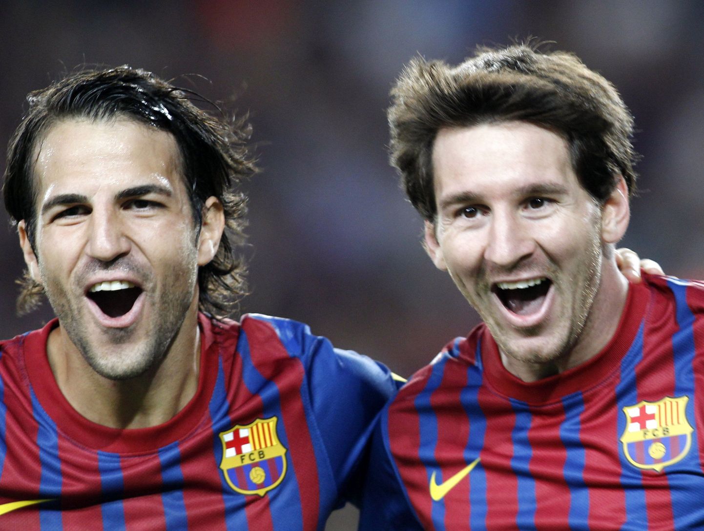Lionel Messi (paremal) ja Cesc Fabregas väravat tähistamas.