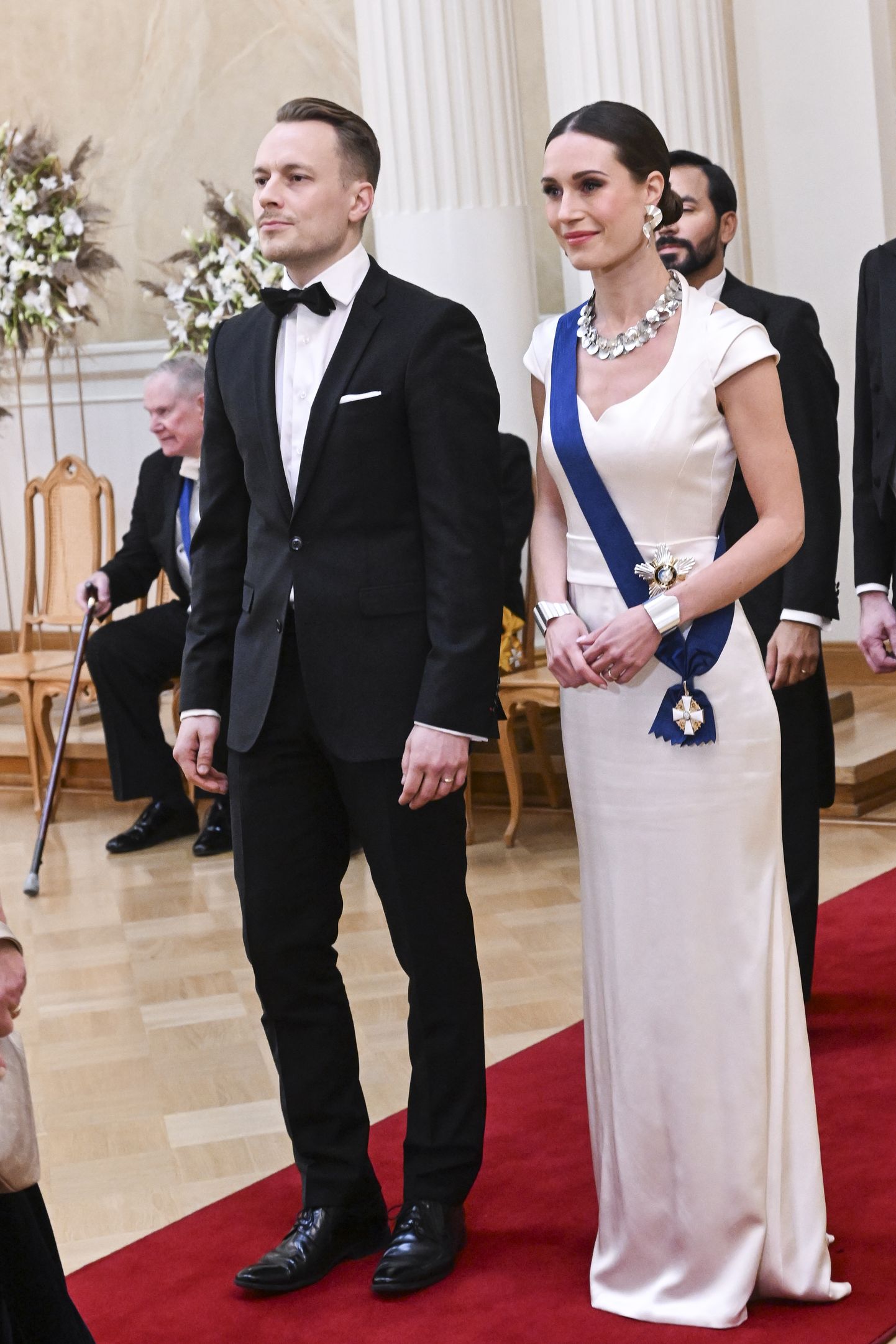 Soome peaminister Sanna Marin ja ta abikaasa Markus Räikkönen 6. detsembril 2022 Helsingis Soome Vabariigi aastapäeva vastuvõtul presidendipalees.