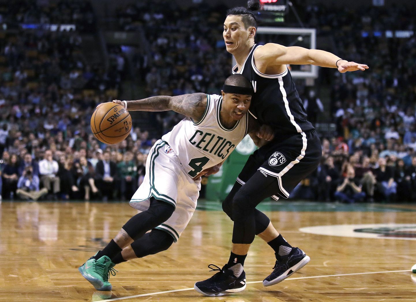Boston Celtics guard Isaiah Thomas (4) tries to drive past Brooklyn Nets guard Jeremy Lin (7) during the second half of an NBA basketball game in Boston, Monday, April 10, 2017. Thomas scored 27 points as the Celtics defeated the Nets 114-105. (AP Photo/Charles Krupa)