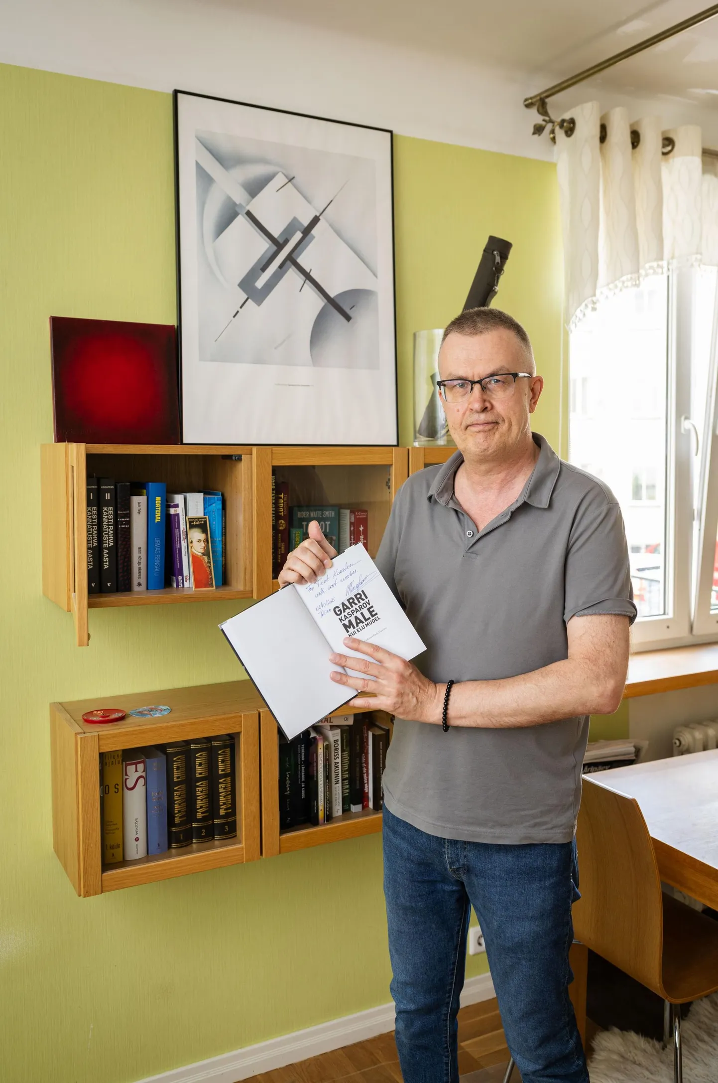 Teet Korsten in his Tallinn apartment, where he is trying to rebuild the book collection that was destroyed in a fire.