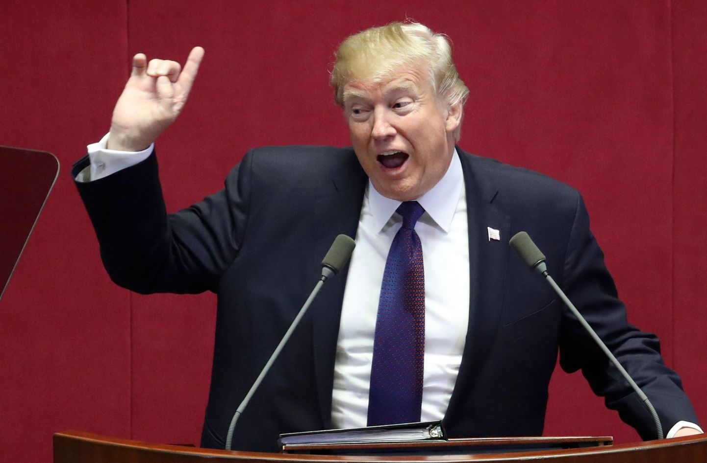 US President Donald Trump (C) addresses the National Assembly in Seoul on November 8, 2017.
Trump's marathon Asia tour moves to South Korea, another key ally in the struggle with nuclear-armed North Korea, but one with deep reservations about the US president's strategy for dealing with the crisis. / AFP PHOTO / Lee Jin-man