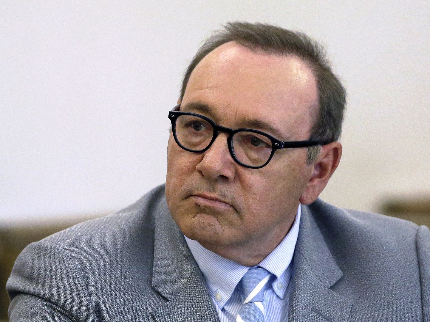 FILE - In this June 3, 2019 file photo, actor Kevin Spacey attends a pretrial hearing at district court in Nantucket, Mass. The Oscar-winning actor is accused of groping the teenage son of a former Boston TV anchor in 2016 in the crowded bar at the Club Car in Nantucket. An attorney for the man who has accused Spacey says, Wednesday, June 19, 2019, that the man cannot find a cellphone he has been ordered to turn over to the defense. Spacey's lawyers want to try to recover text messages they say would help the actor's case. (AP Photo/Steven Senne)