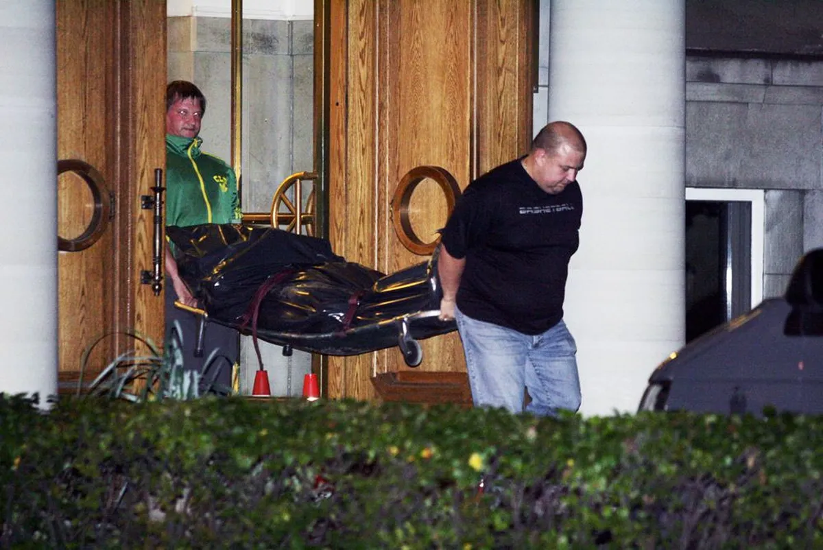 Estonian Authorities carrying the body of the terrorist who attacked the Ministry of Defense building in Tallinn on August 11, 2011.