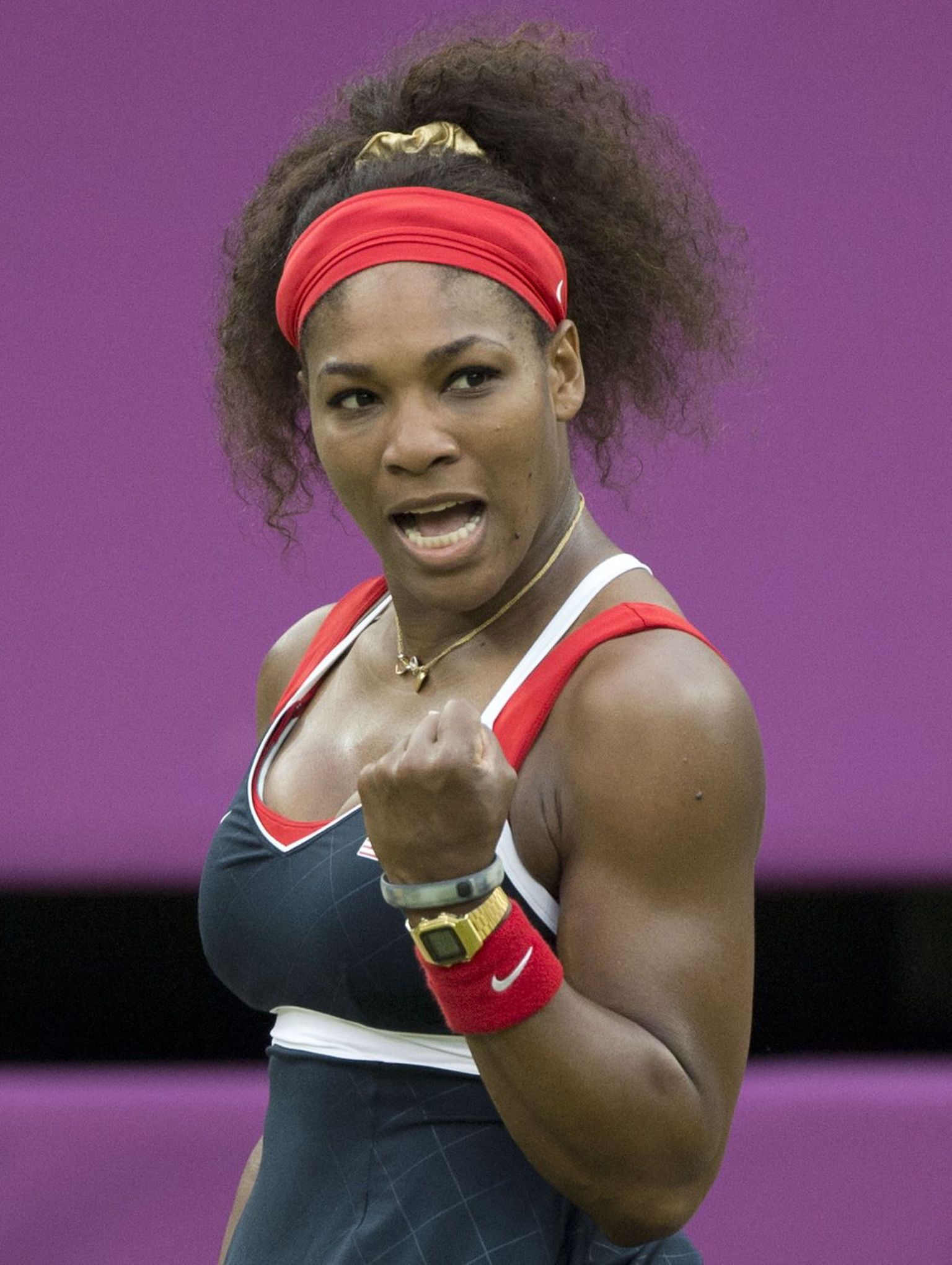 Serena Williams of the US reacts after a shot to Russia's Vera Zvonareva during their women's singles tennis match at the 2012 London Olympic Games at the All England Tennis Club in Wimbledon, southwest London, on August 1, 2012. AFP PHOTO / JOHN MACDOUGALL