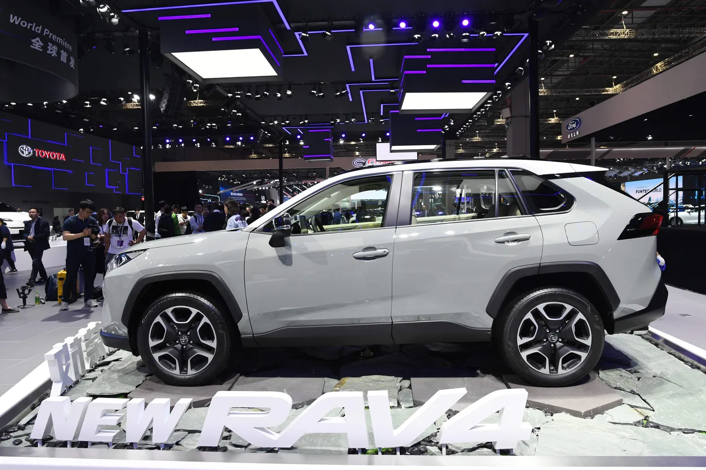 A Toyota Rav4 is displayed on the opening day of the Shanghai Auto Show in Shanghai on April 16, 2019. - Global car makers flock to the Shanghai Auto Show this week with the world's largest vehicle market facing an unfamiliar sales slump just as China veers toward an ultra-competitive electric future. (Photo by GREG BAKER / AFP)