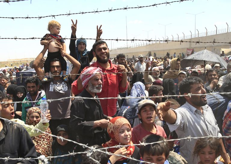 Süüria põgenikud piiripunktis Türgiga.
