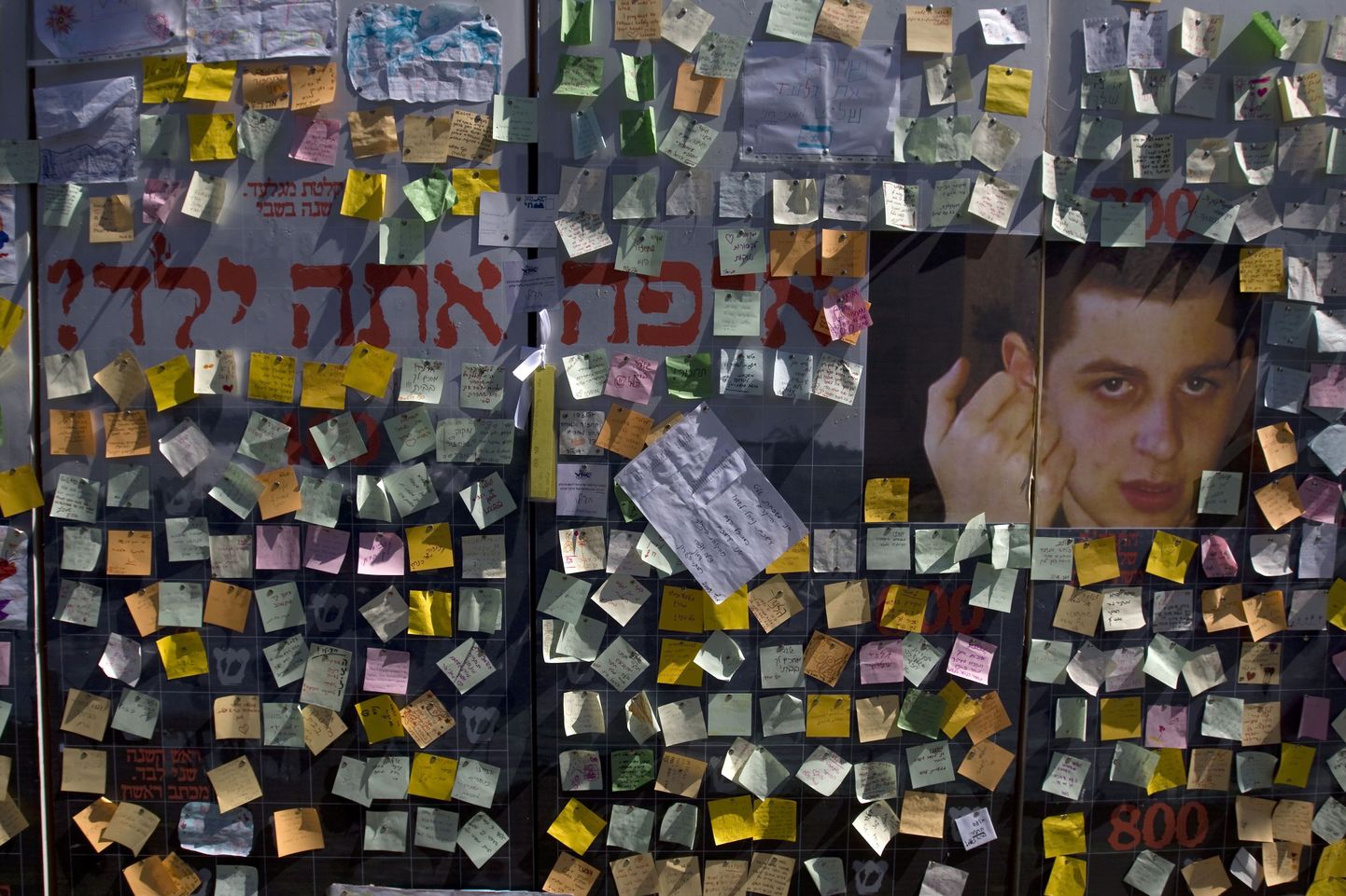 A mural with messages for captured Israeli soldier Gilad Shalit hangs near a protest tent calling for Shalit's release set up in front of Prime Minister Ehud Olmert's house in Jerusalem on March 17, 2009. The writing in Hebrew reads, ?Where is the kid?. Eleventh-hour talks on an Israel-Hamas prisoner swap appeared to collapse as both sides accused each other of about-turns and bad faith during the Egyptian-brokered efforts. The crunch negotiations had aimed to secure the release of Israeli soldier Gilad Shalit, seized by Gaza militants in June 2006, in exchange for the freeing of hundreds of Palestinian prisoners.     AFP PHOTO/YOAV LEMMER