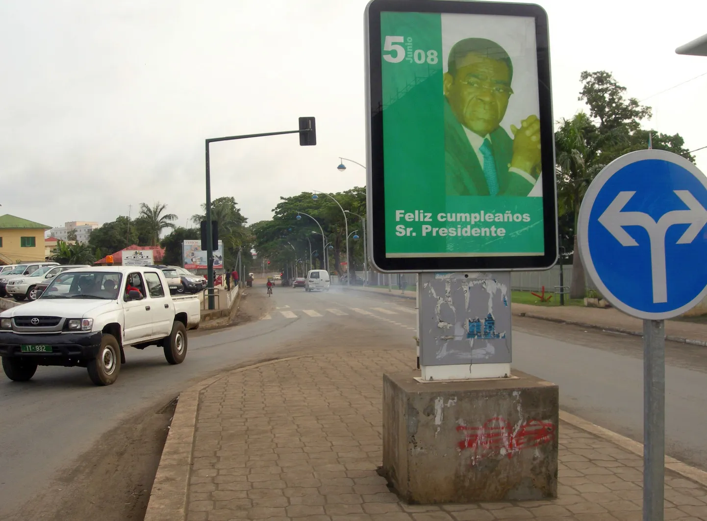 TO GO WITH AFP STORY : Guinee equatoriale: 'Culte de la personnalite pour Teodoro Obiang' by Patrick Fort
A car drives past an official portrait of President Teodoro Obiang Nquema on a street of Malabo, Equatorial Guinea, on July 10, 2008. Hagiographies, portraits, flattering articles, songs... the Equatorial Guinea President who has been ruling the country with an iron fist since 1979, has organized a cult around his personnality.     AFP PHOTO / PATRICK FORT