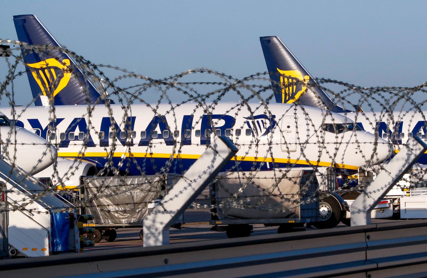 FILE PHOTO: Ryanair aircraft are parked on the tarmac during a wider European strike at the airline to protest slow progress in negotiating a collective labour agreement, at Brussels South Charleroi Airport, Belgium August 10, 2018.  REUTERS/Yves Herman/File Photo