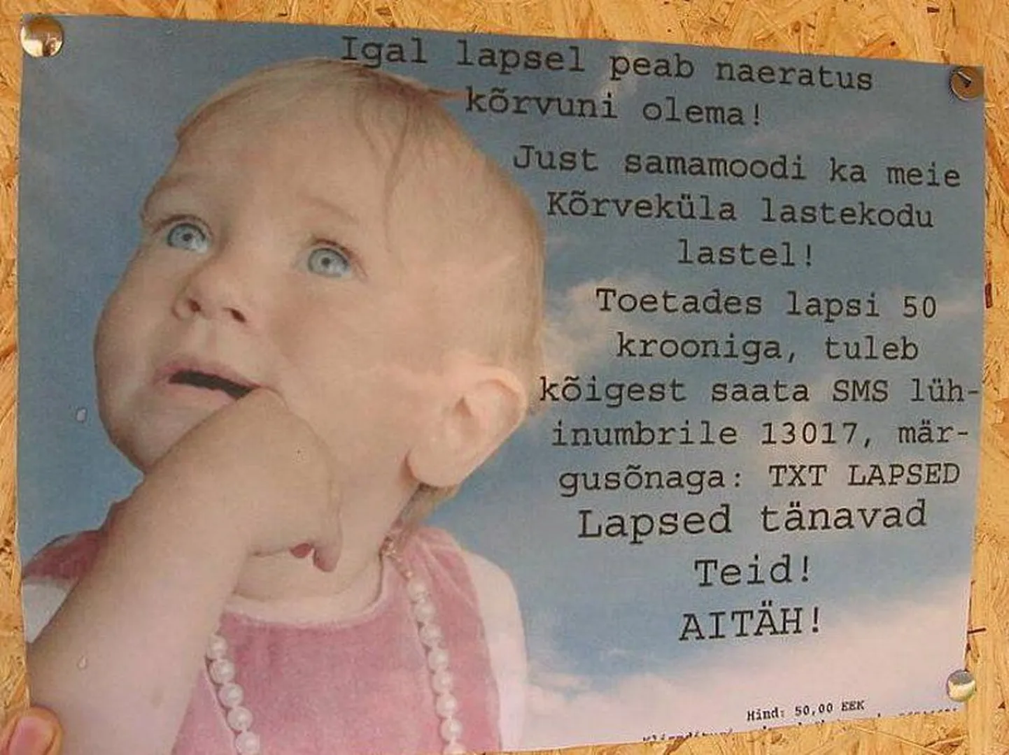 Fantoomlastekodu plakat, mis kutsub inimesi annetama.