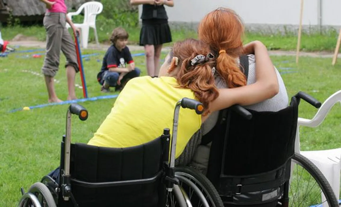Люди в инвалидных колясках. Фото иллюстративное.