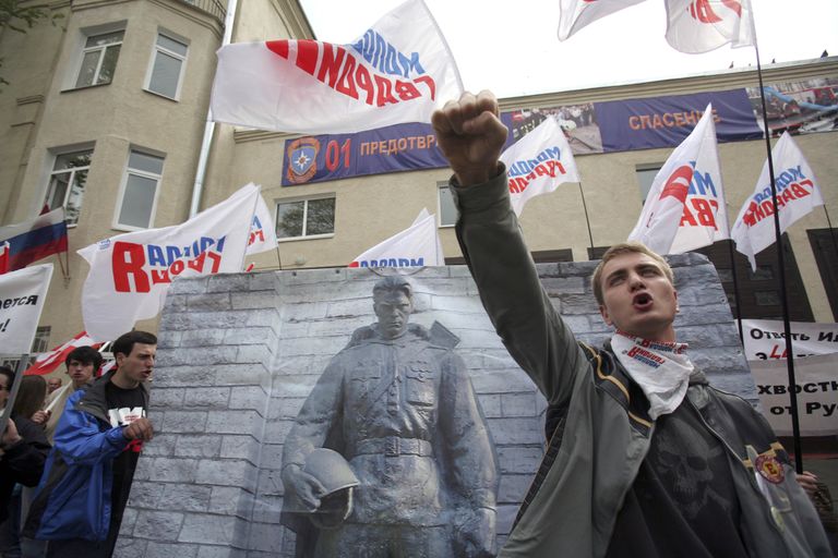 Members of Youth Guards Young Russia and Nashi movements hold a photograph of WWII memorial in Tallinn as they rally outside Estonian Embassy in downtown Moscow Friday, April 27, 2007.