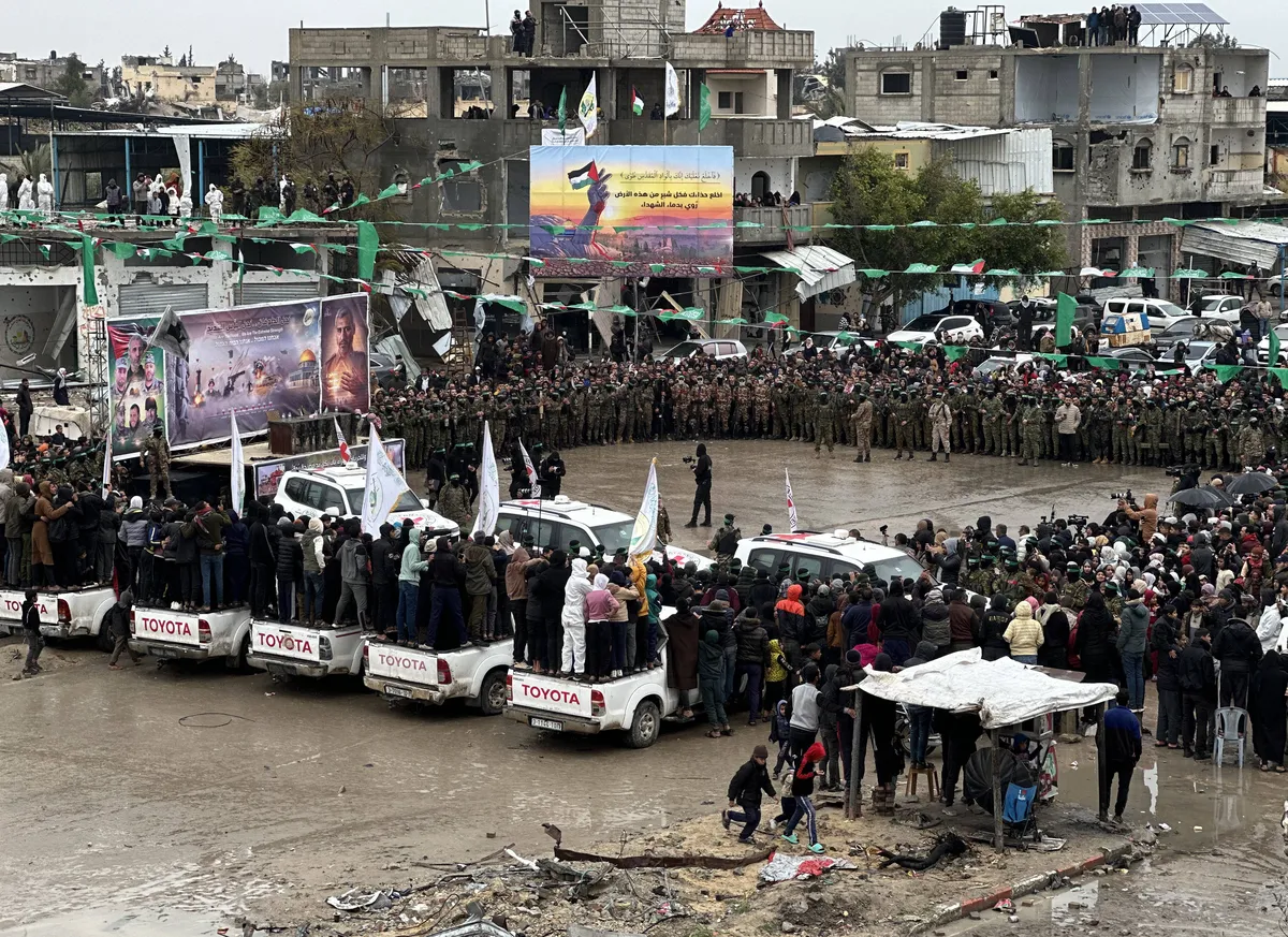 Al-Qassam Brigades, the military wing of Hamas, take security measures as they hand over on Saturday two Israeli hostages to the International Committee of the Red Cross (ICRC) as part of the seventh exchange under the Jan. 19 ceasefire deal in Rafah, southern Gaza, on February 22, 2025.