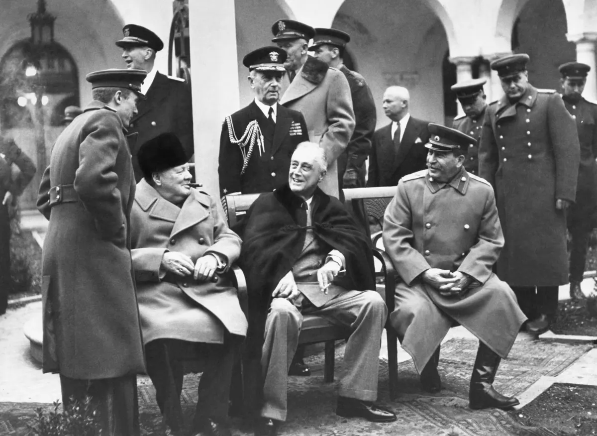 Churchill, Roosevelt, and Stalin seated at the Yalta Conference in Crimea, where the three discussed the post-war reorganization of Europe.