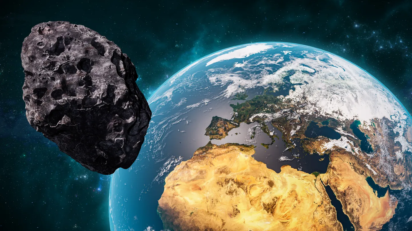 Maa ja asteroid. Pilt on illustreeriv