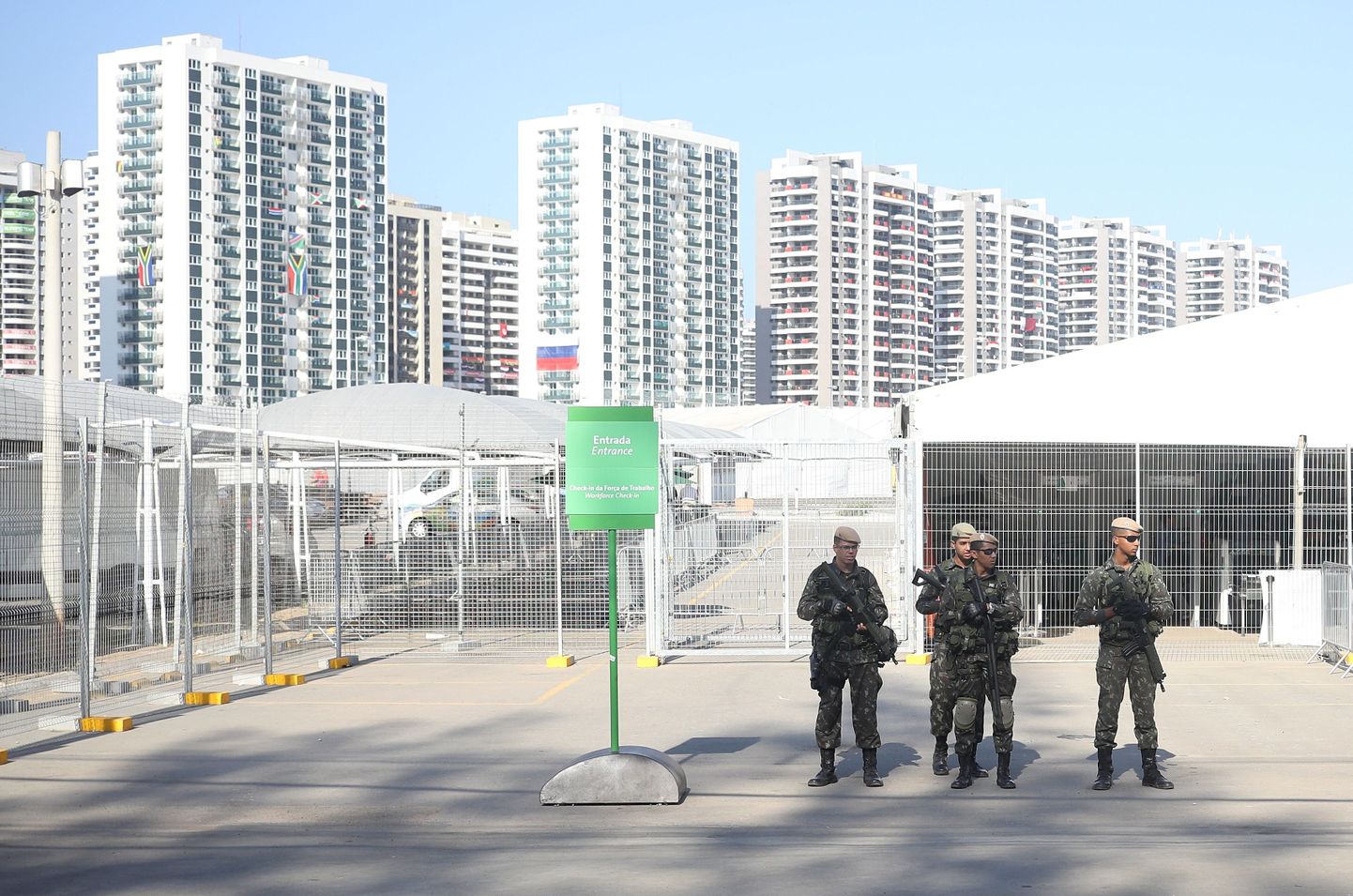 Rio Olympics - Olympic Village - Rio de Janeiro, Brazil - 05/08/2016. Soldiers stand outside workers entrance to athletes village.               REUTERS/Phil Noble  FOR EDITORIAL USE ONLY. NOT FOR SALE FOR MARKETING OR ADVERTISING CAMPAIGNS.
