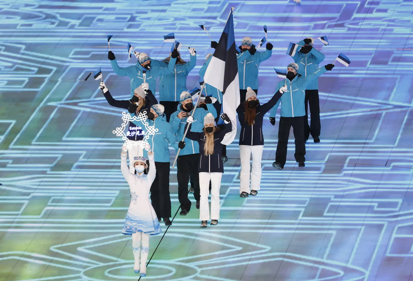 2022 Beijing Olympics - Opening Ceremony - National Stadium, Beijing, China - February 4, 2022.
Flag bearers Kelly Sildaru of Estonia and Martin Himma of Estonia lead their contingent during the athletes parade at the opening ceremony. REUTERS/David W Cerny