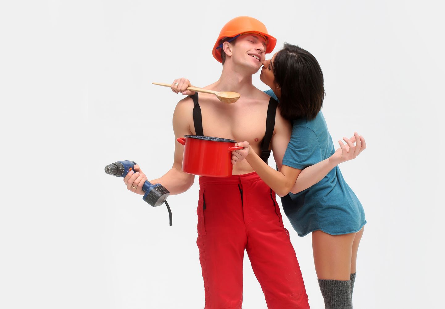 sexy household happy couple of pretty girl and handsome man with muscular torso in helmet with red pot and blue drill isolated on white background, copy space