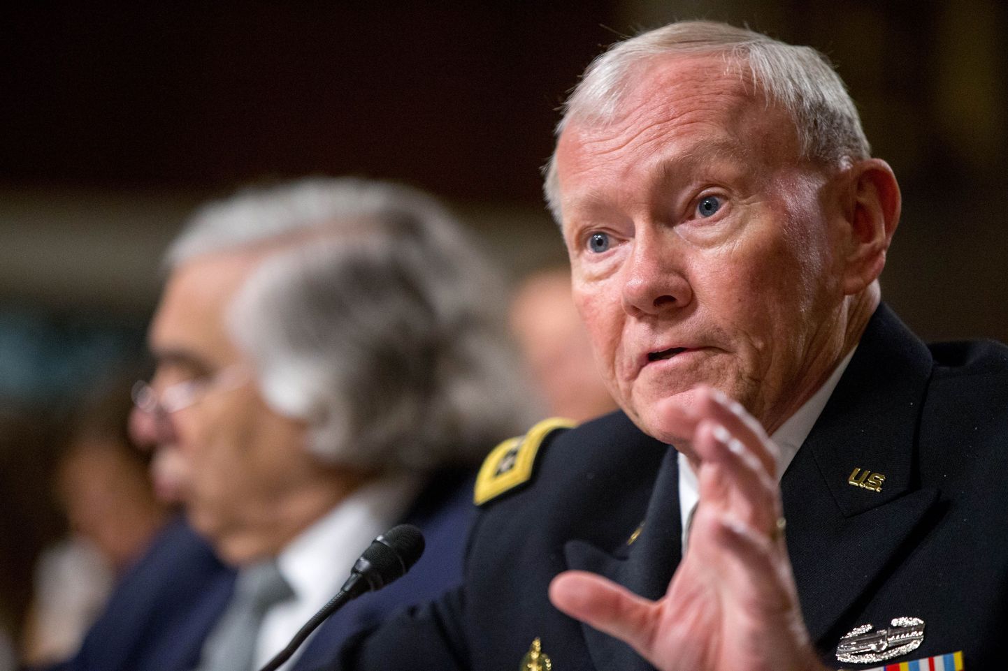 Joint Chiefs Chairman Gen. Martin Dempsey, right, testifies on Capitol Hill in Washington, Wednesday, July 29, 2015, before the Senate Armed Services Committee hearing on the impacts of the Joint Comprehensive Plan of Action (JCPOA) on U.S. Interests and the Military Balance in the Middle East. Energy Secretary Ernest Moniz is at left. (AP Photo/Andrew Harnik)
