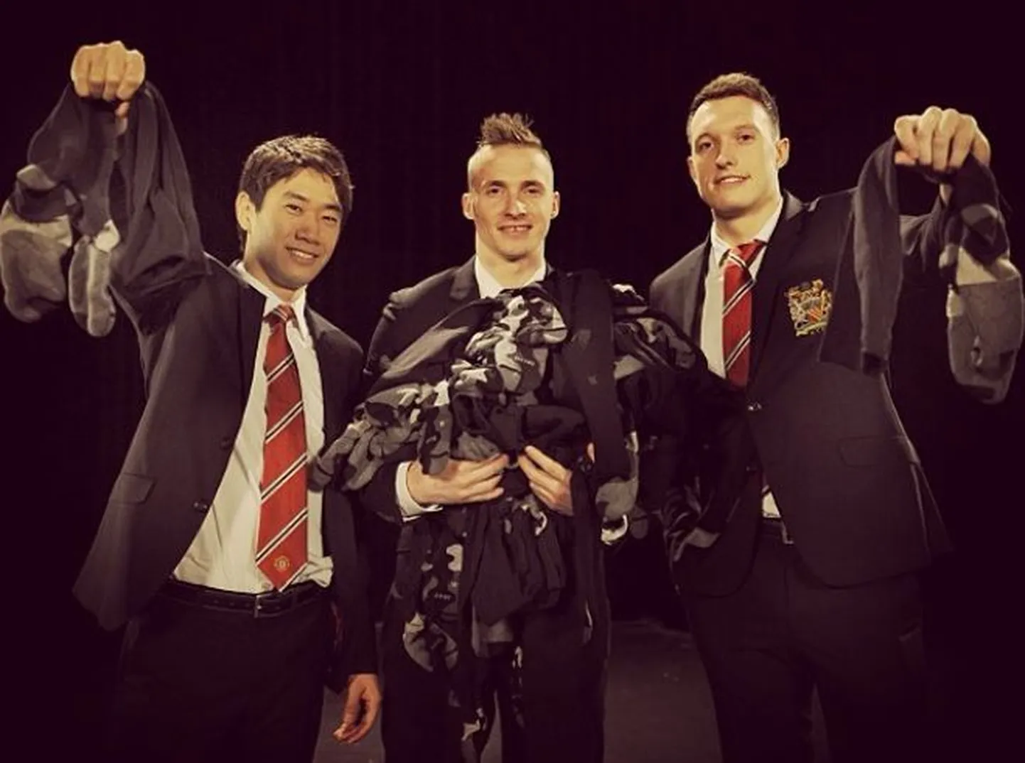 Shinji Kagawa (vasakul), Alex Buttner ja Phil Jones.