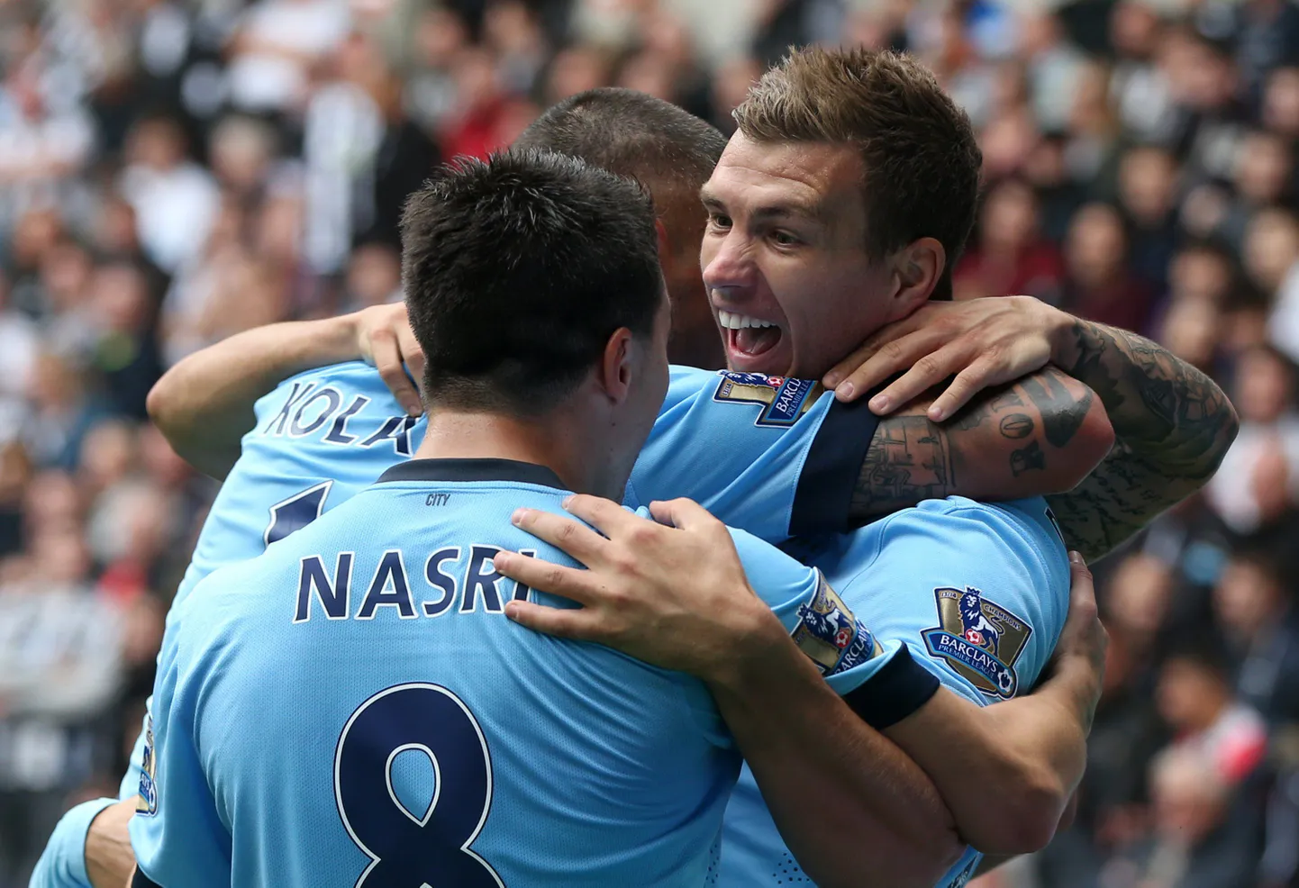 Võidukad Manchester City mängijad.