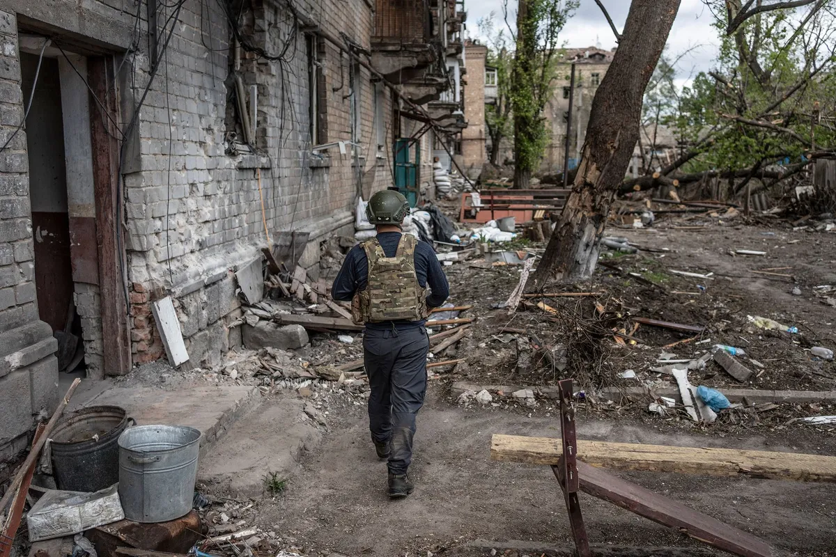 Ukrainian volunteer patrolling in Chasiv Yar, Donetsk oblast.