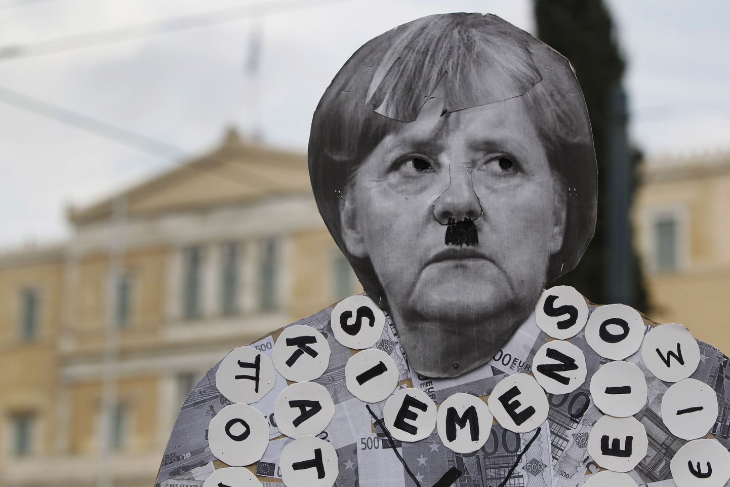 Angela Merkeli Kreeka visiidi jaoks tehtud poster.