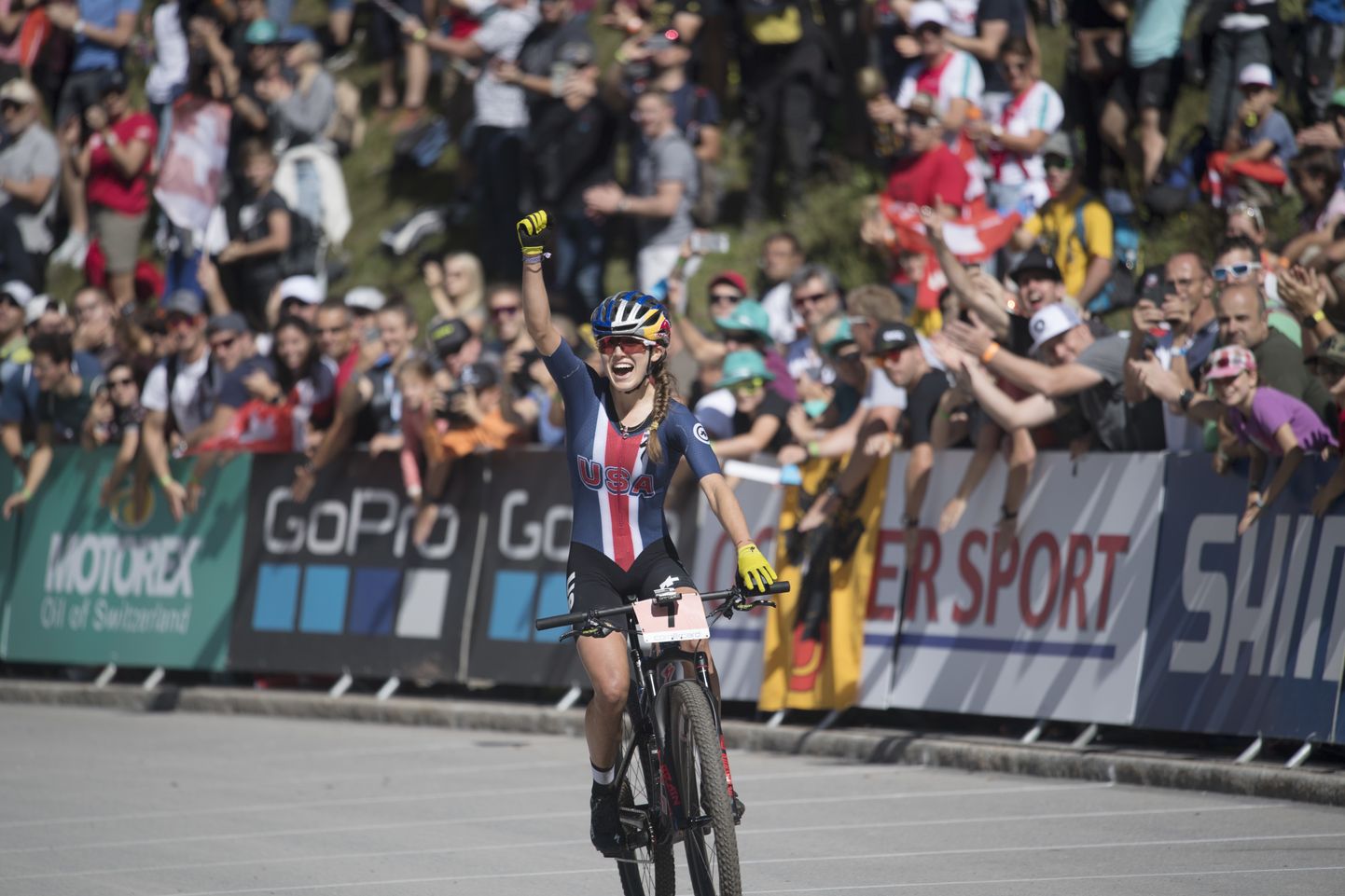 Kate Courtney from the U.S wins the women's elite cross country olympic race at the UCI mountain bike world championships in Lenzerheide, Switzerland, Saturday, Sept. 8, 2018. The World Championships takes place from Sept. 5 till Sept. 9, 2018. (Gian Ehrenzeller/Keystone via AP)