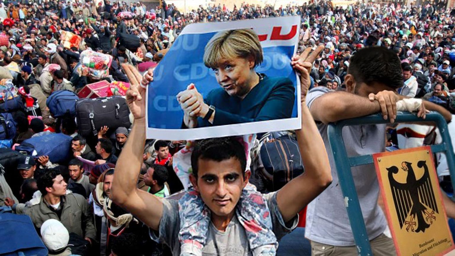 Migrant Angela Merkeli portreega. Foto on illustratiivne.