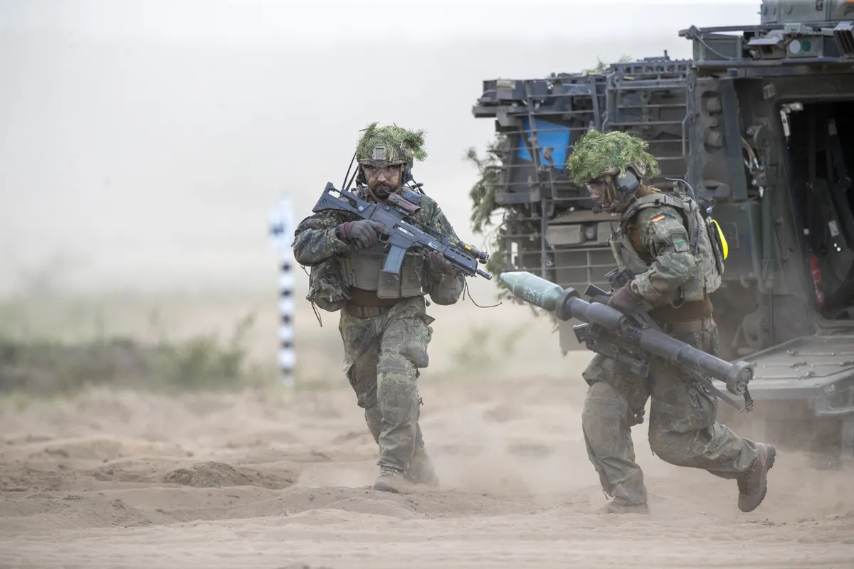German soldiers take part in the Lithuanian-German division-level international military exercise 'Grand Quadriga 2024' at a training range in Pabrade, north of the capital Vilnius, Lithuania on Wednesday, May 29, 2024. 'Grand Quadriga 2024', a wide-scale exercise of the German Bundeswehr that rehearses moving two divisions from the central part of Europe to eastern. Over 3 thousand German troops and military equipment has been moved to Lithuania.(AP Photo/Mindaugas Kulbis) XMK163