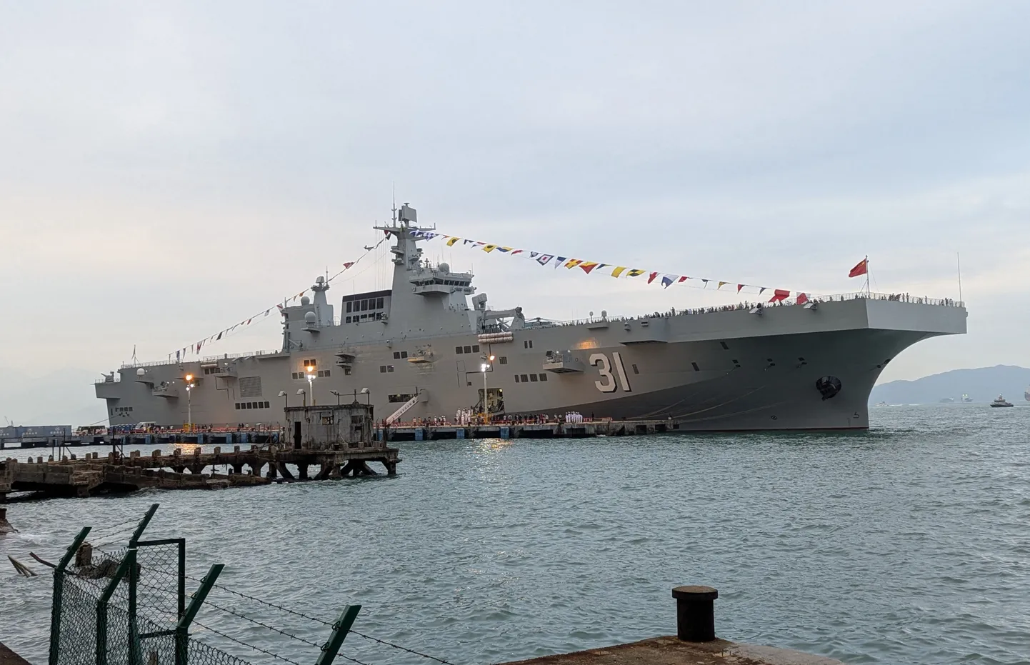 The Chinese People's Liberation Army (PLA) Navy formation, Type 075 amphibious assault ship, Hainan is docked at the China Merchants Wharf in Hong Kong on November 24, 2024, as part of a publicity visit. (Photo by Holmes CHAN / AFP)