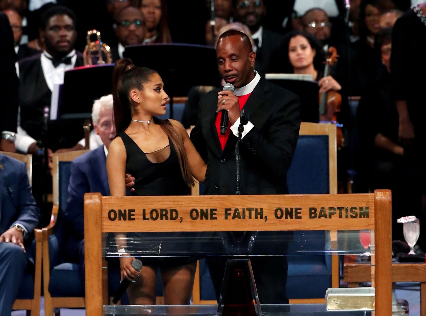Pastor Charles Ellis speaks as he stands with singer Ariana Grande after she performed at the funeral service for Aretha Franklin at the Greater Grace Temple in Detroit, Michigan, U.S., August 31, 2018. Picture taken August 31, 2018.  REUTERS/Mike Segar - RC1A21CEEE50