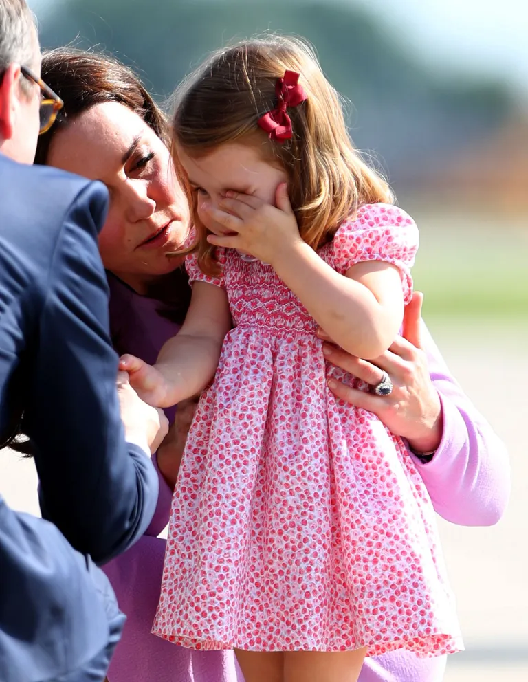 Princess Kate, the Duchess of Cambridge and Princess Charlotte before boarding their plane in Hamburg Finkenwerder, Germany, July 21, 2017. REUTERS/Daniel Bockwoldt/POOL