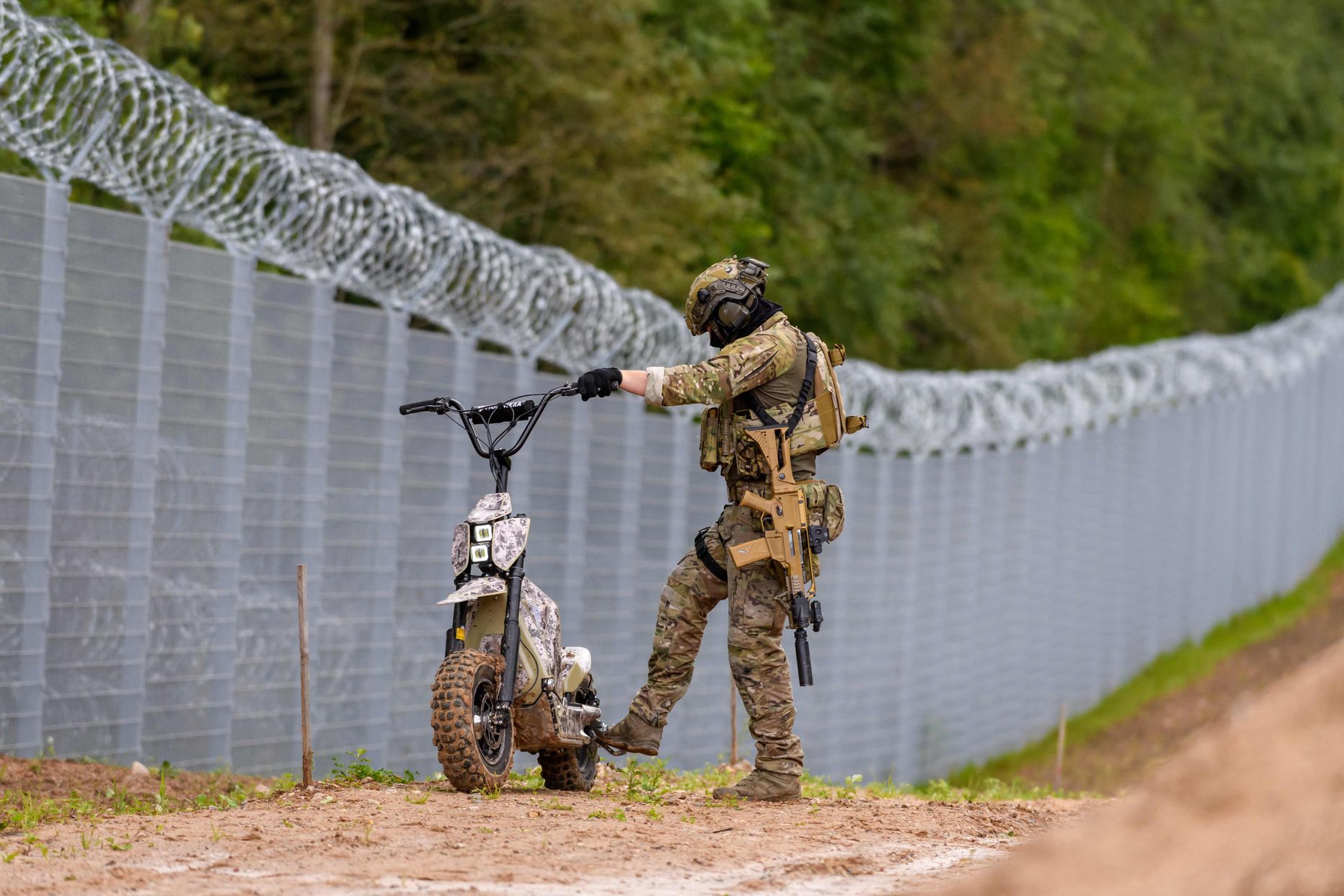 A member of the State Border Guard (SBG) patrols at the Latvia/Belarus border near Krivanda, Eastern Latvia.
