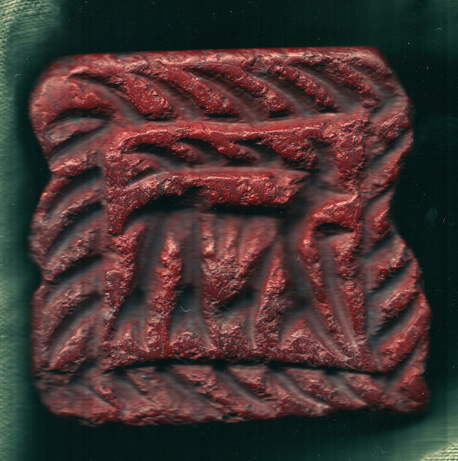 Süüriast Tell Zeidanist leitud punasest kivist pitser