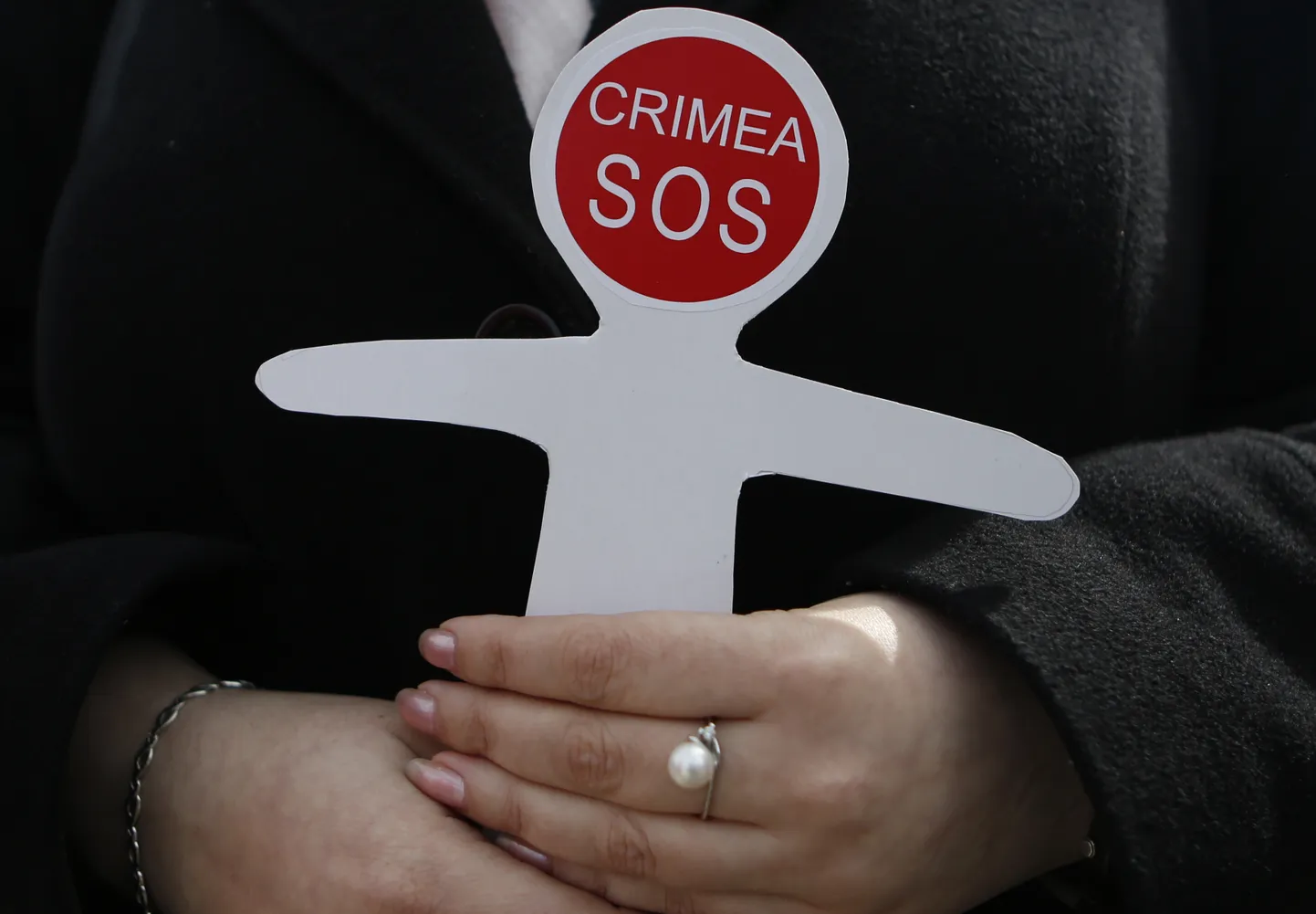 Ukrainian and Crimean Tatar activists hold paper figures symbolizing victims of the Russian annexation of Crimea during a flashmob in Kiev, Ukraine, Wednesday, March 16, 2016. In mid-March 2014, Crimea re-joined Russia following a referendum. More than 82% of the electorate took part in the vote. Over 96% backed splitting from Ukraine and spoke in favor of reuniting with Russia. (AP Photo/Sergei Chuzavkov)