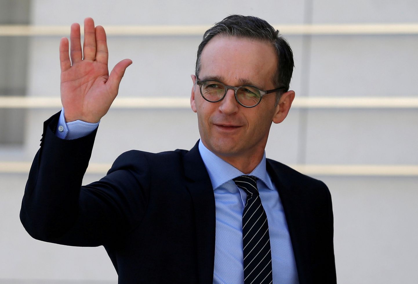 FILE PHOTO: German Foreign Minister Heiko Maas waves upon his arrival to meet with Palestinian President Mahmoud Abbas meets in Ramallah, in the occupied West Bank March 26, 2018. REUTERS/Mohamad Torokman/File Photo