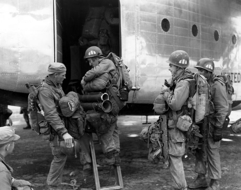 Airborne troops of the 187th Regimental Combat Team load aboard a USAF C-119 RCT for a drop behind communist-led North Korean  lines, north of Pyongyang

October 1950
