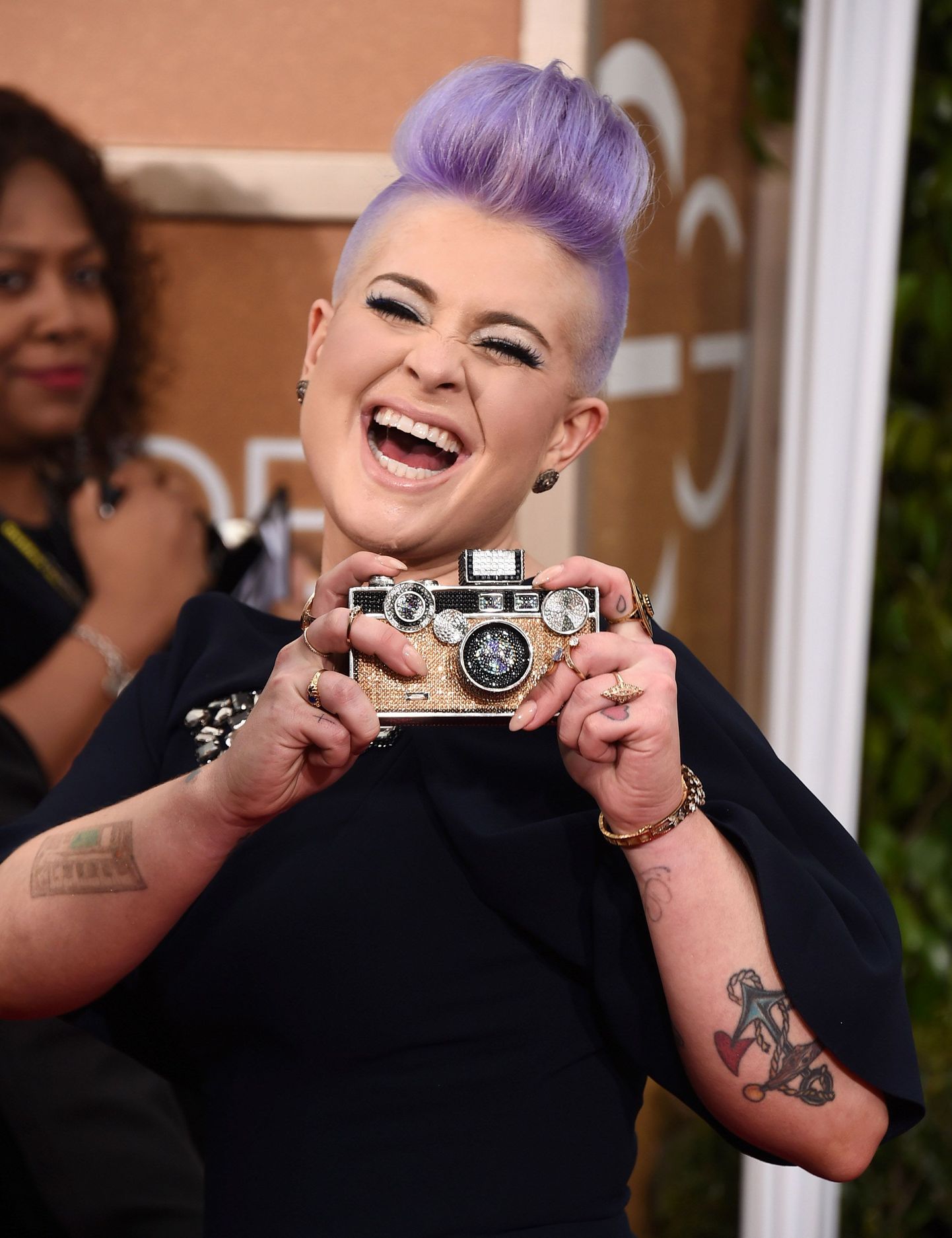 Kelly Osbourne arrives at the 72nd annual Golden Globe Awards at the Beverly Hilton Hotel on Sunday, Jan. 11, 2015, in Beverly Hills, Calif. (Photo by Jordan Strauss/Invision/AP)